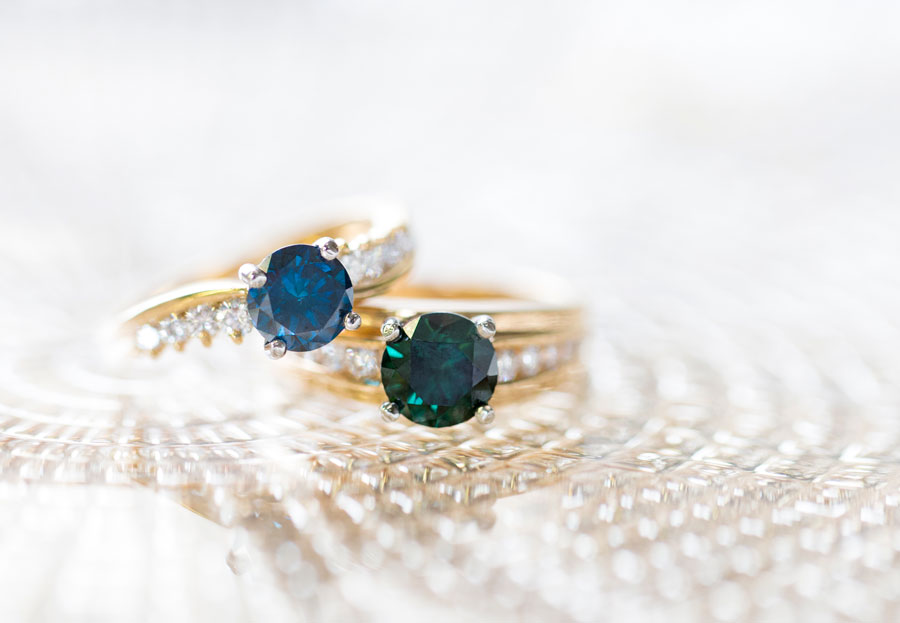 Green and blue diamond rings.